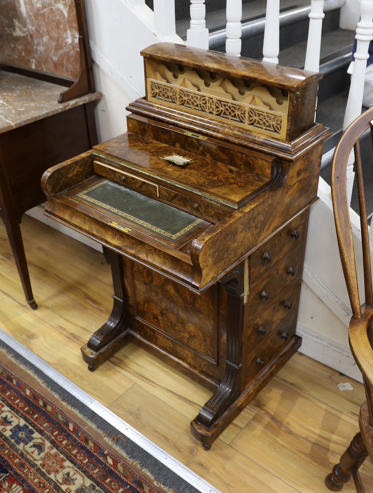 A late Victorian Maple & Co. burr walnut pop-up Davenport, width 59cm, depth 56cm, height 104cm